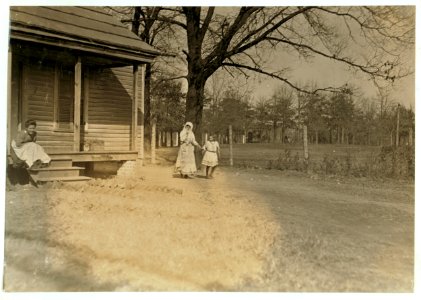 Woman from Atherton Mill, Charlotte, N.C., and her little girl, evidently her 'helper.' Superintendent forbade absolutely my taking photos anywhere on the company's premises. LOC nclc.01566