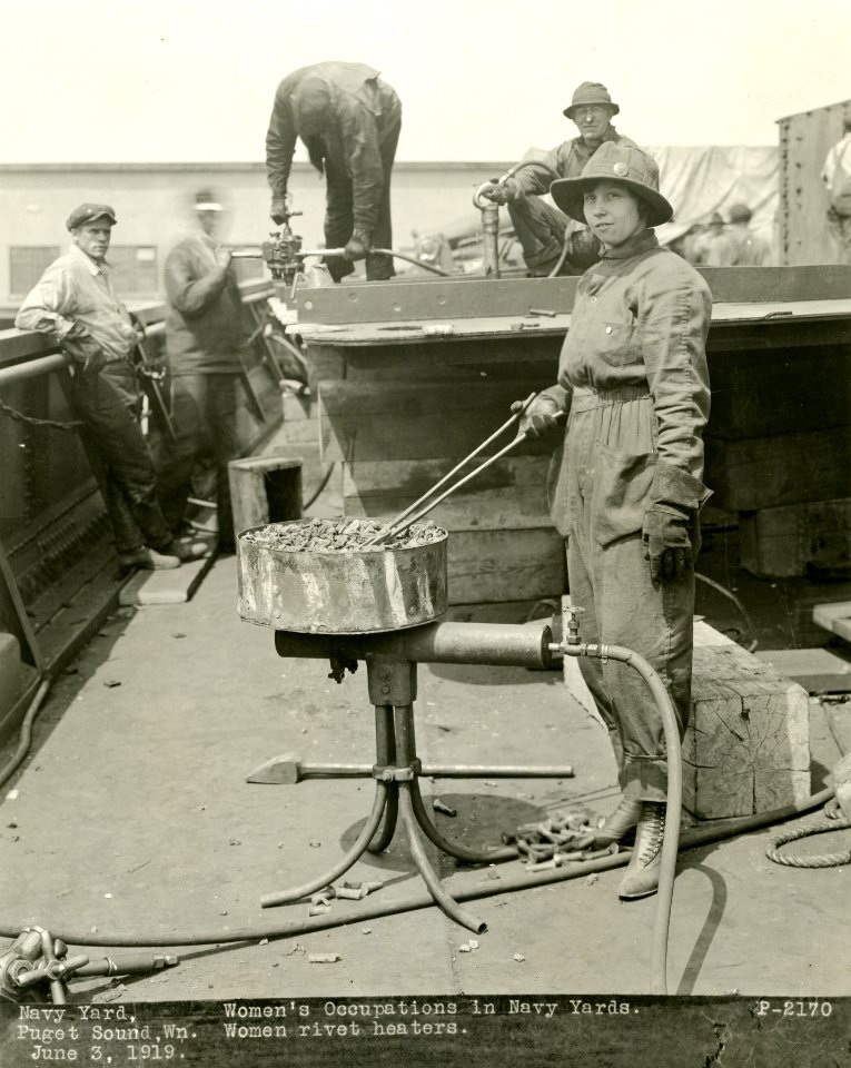 Woman heating rivets