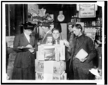 Woman in the Red Cross Commission's warehouses at Rotterdam, Holland giving American canned food to refugees) - Harris & Ewing, Washington, D.C LCCN95502513