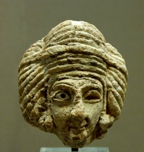 Woman head Tell Asmas Louvre AO12434