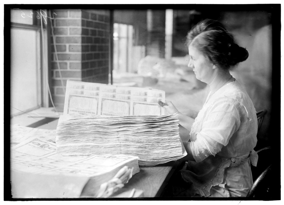 Woman holding $50 bonds, probably Liberty Bonds. Engraving and Printing, Bureau of Treasury Dept. LOC hec.11328