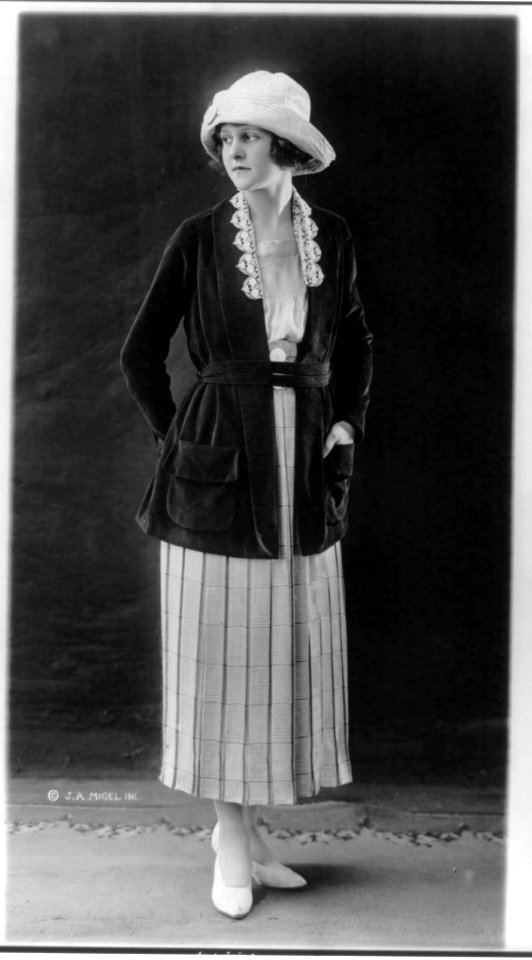 Woman modeling skirt, blouse, coat, hat and shoes LCCN2003678055