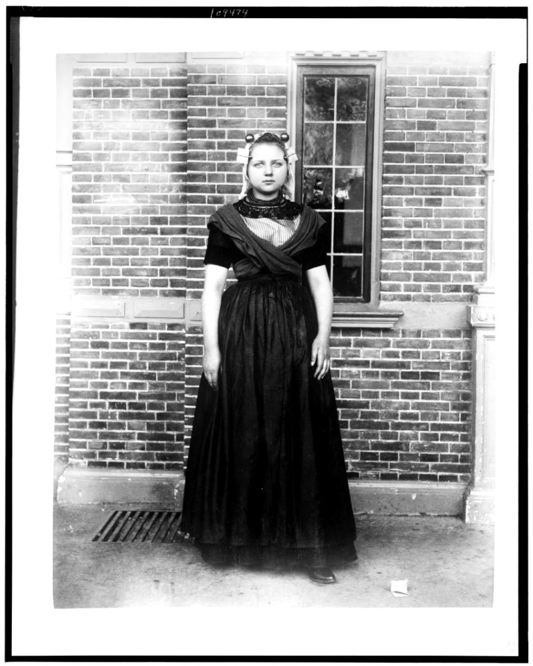 Woman in traditional Dutch dress in front of Cacao van Houten exhibit, Paris Exposition, 1889 LCCN93516731