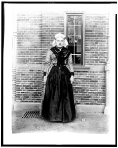 Woman in traditional Dutch dress in front of Cacao van Houten exhibit, Paris Exposition, 1889 LCCN93516729
