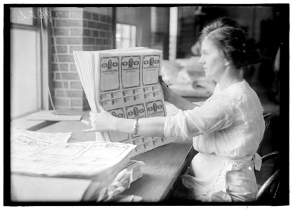 Woman holding $50 bonds, probably Liberty Bonds. Engraving and Printing, Bureau of Treasury Dept LOC hec.11329