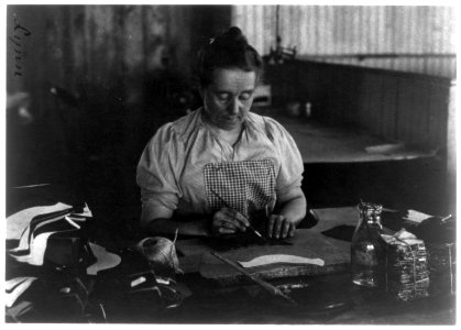 Woman seated at a table, working in a shoe factory, Lynn, Mass. LCCN2006681290