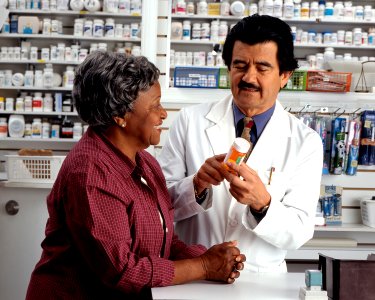 Woman consults with pharmacist (2)