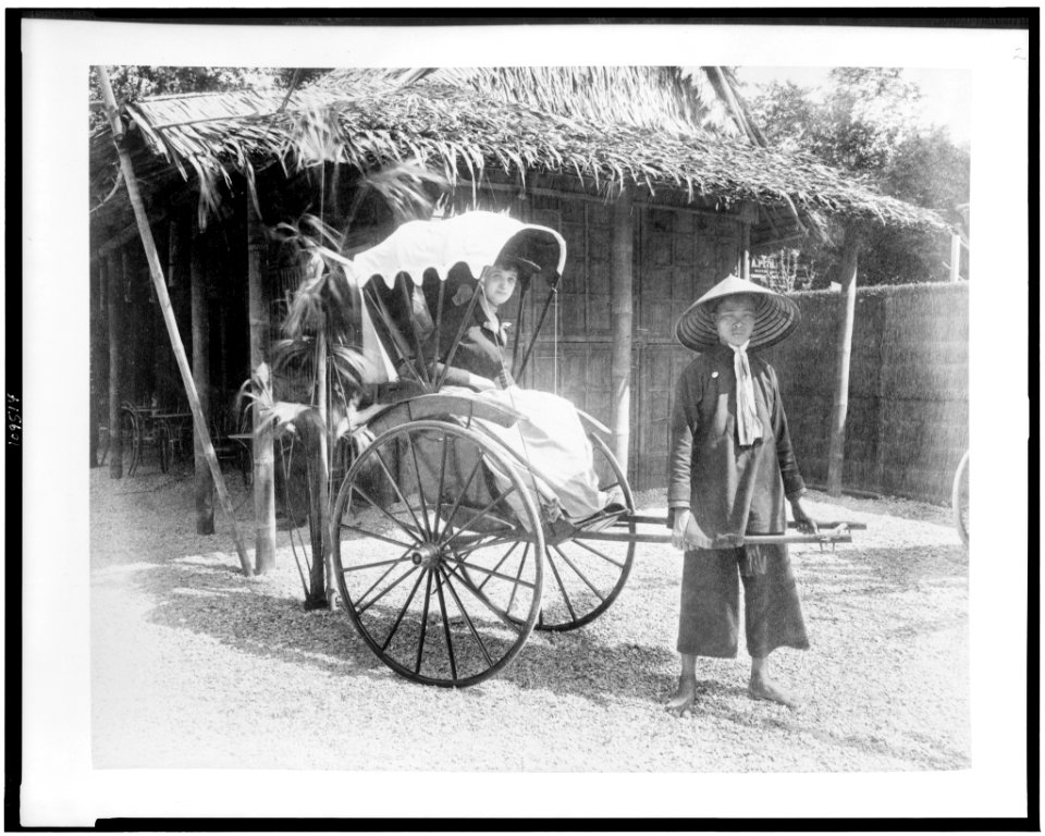 Woman seated in pousse-pousse drawn by man in Tonkin Village, Paris Exposition, 1889 LCCN94500836
