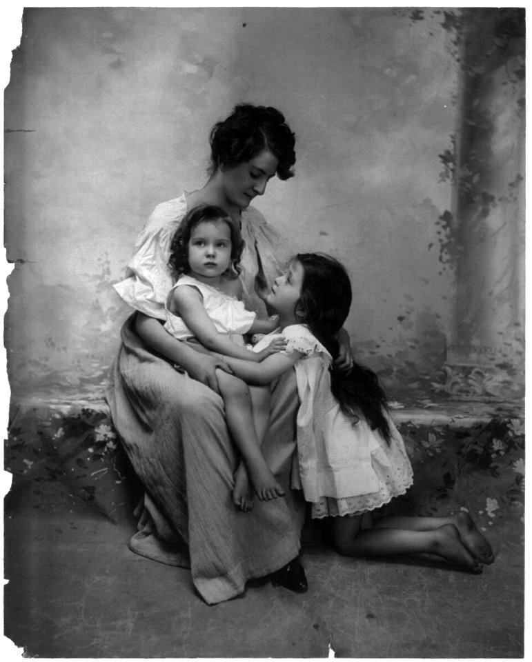 Woman seated with 2 children LCCN2003675178