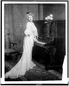Woman standing at piano LCCN91731181