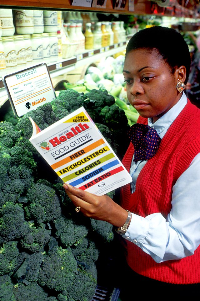 Woman shops for broccoli