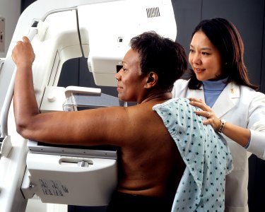 Woman receives mammogram photo