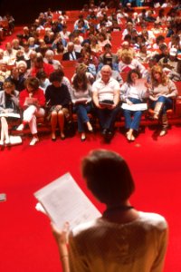 Woman speaks to crowd photo