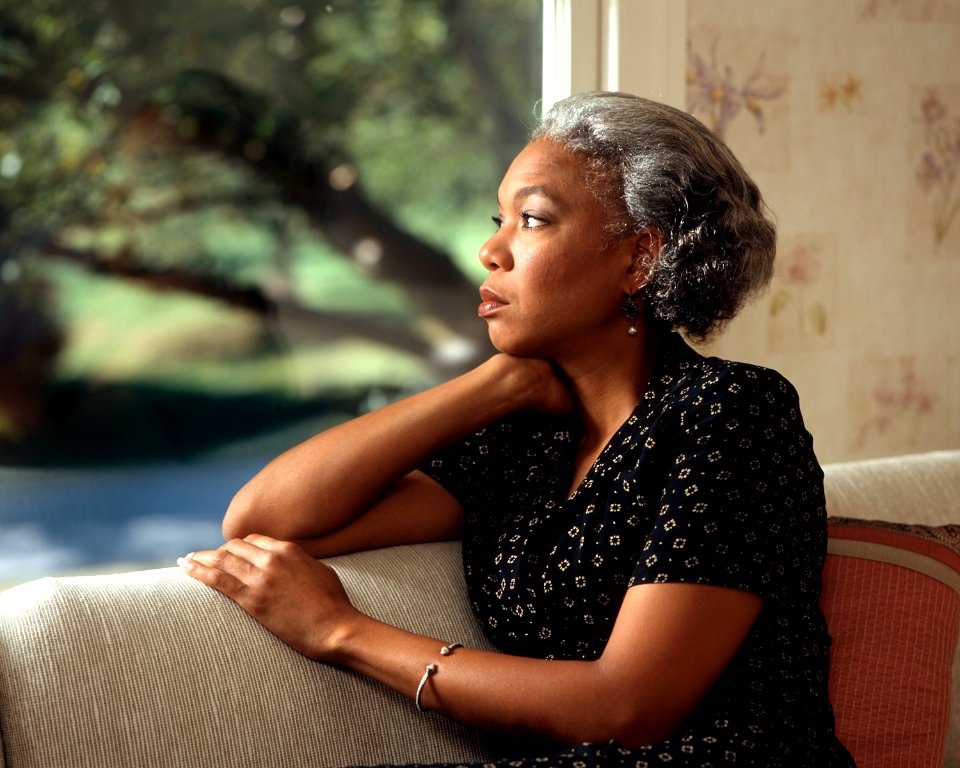 Woman staring out window