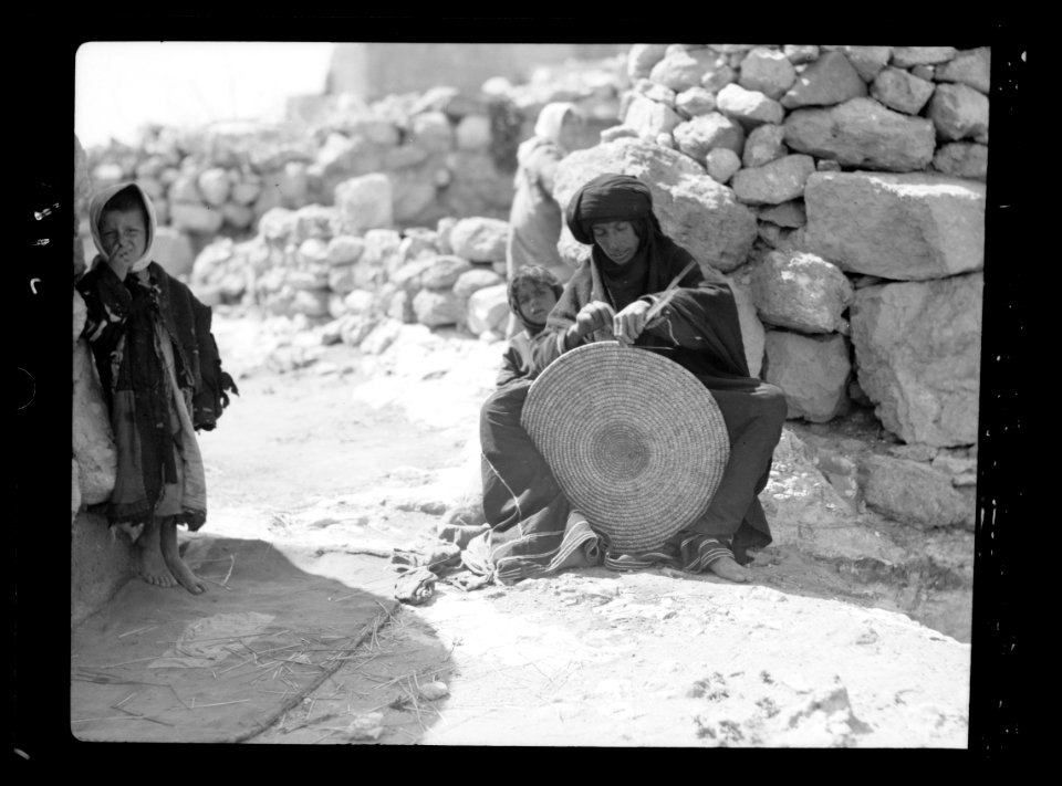 Woman weaving a straw mat. Semi Bedouin type in M'Keis, ancient Gadara LOC matpc.15656