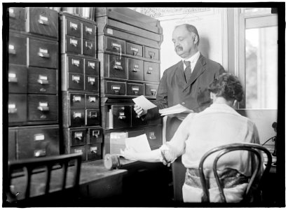 WOMAN SUFFRAGE. NATIONAL WOMEN'S PARTY HEADQUARTERS; OFFICE. SEN. CURTIS EXAMINING FILES LCCN2016870427