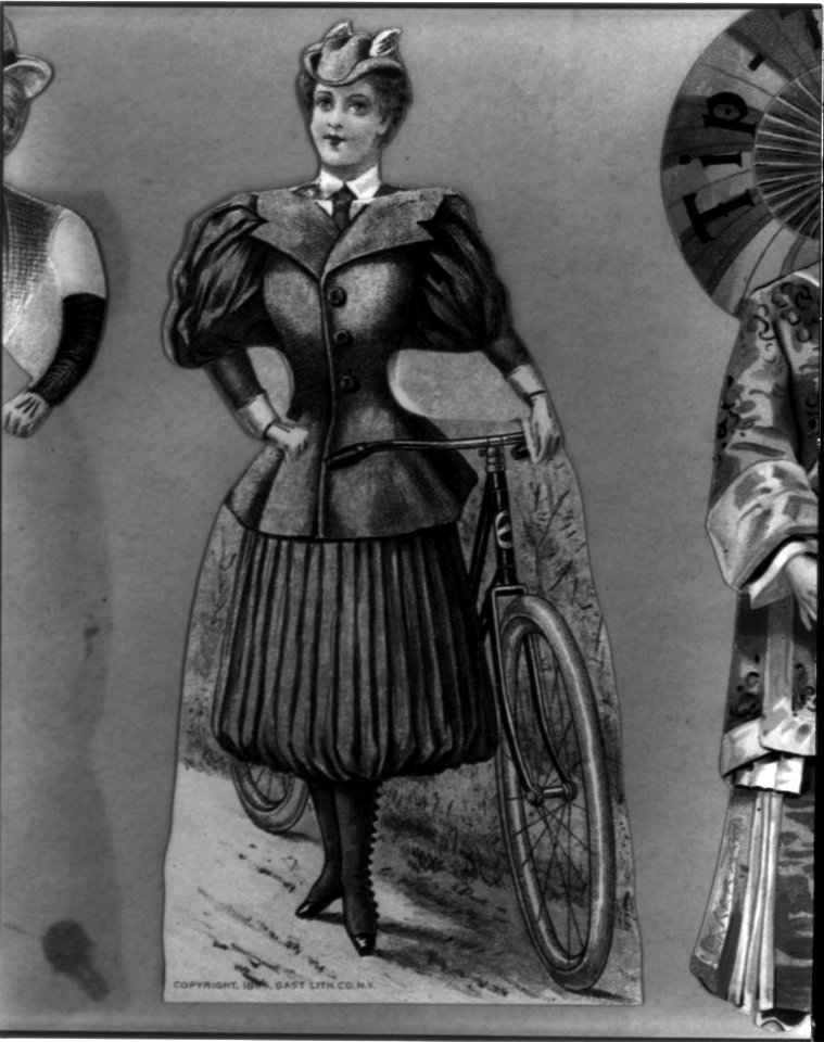 Woman with bicycle wearing bicycling costume; 2 piece package enclosure for Pope Manufacturing Co., Hartford, Conn., manufacturers of Columbia Bicycles LCCN2002712516
