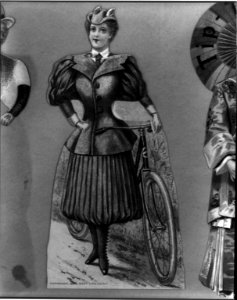 Woman with bicycle wearing bicycling costume; 2 piece package enclosure for Pope Manufacturing Co., Hartford, Conn., manufacturers of Columbia Bicycles LCCN2002712516