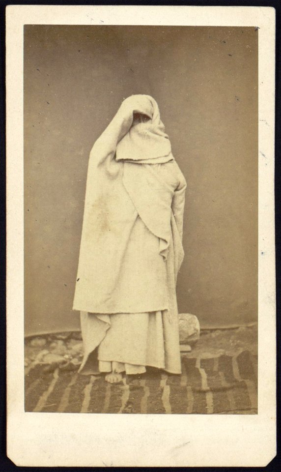 Woman wearing a chador or full burka, full-length portrait, standing, facing front LCCN2005677253