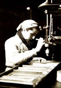 Woman using drill while producing French aircraft, WWII (34340679751)