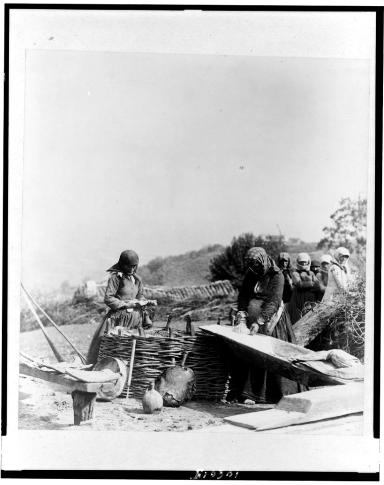 Women baking bread outdoors, Caucasus, Georgia (Republic) LCCN92519158
