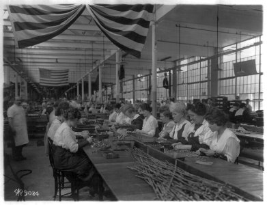 Women seated at table, inspecting 45 automatic pistol parts, at Colt's Patent Fire Arms Plant, Hartford, Connecticut LCCN2006679078 photo