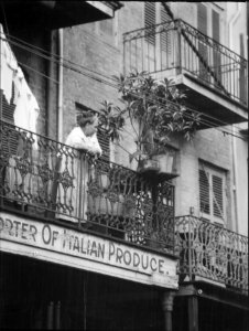 WomanOnBalconyGentheItalianProduce photo