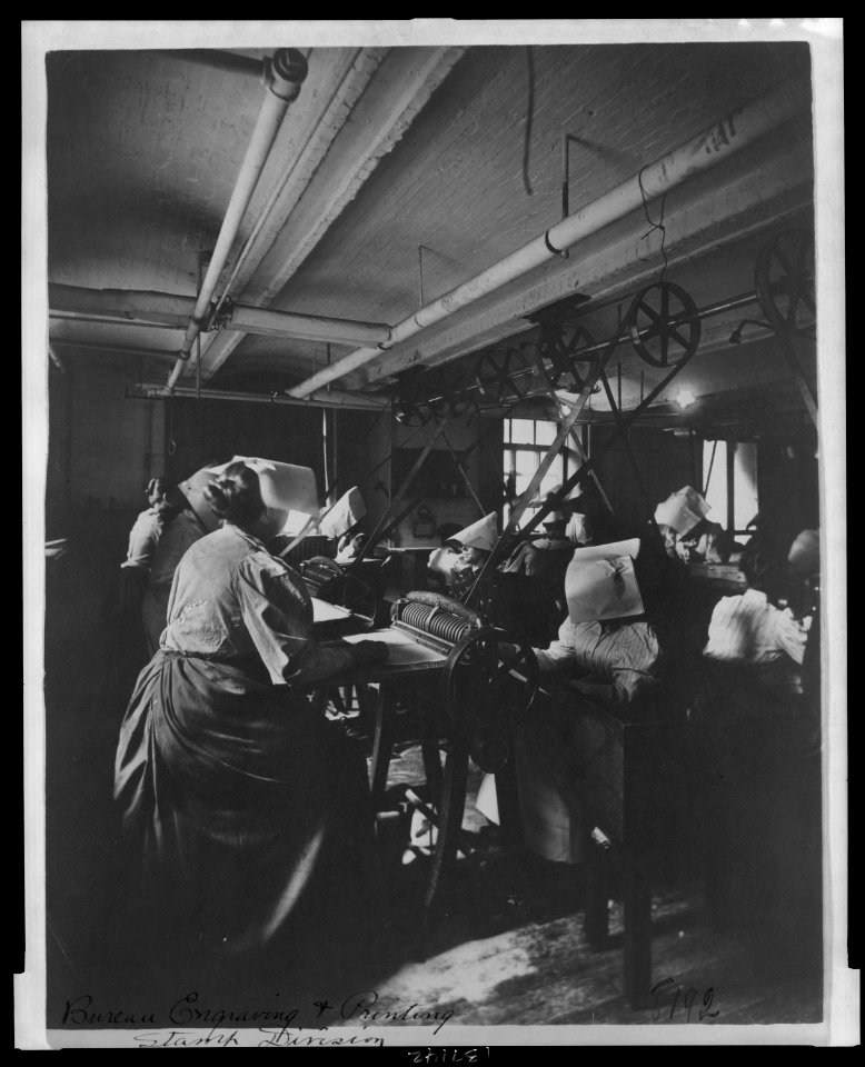 Women perforating sheets of stamps in the Stamp Division at the Bureau of Engraving & Printing LCCN2006692529