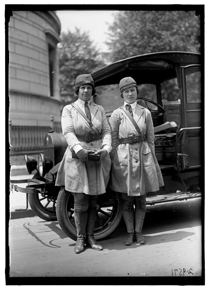 Women in uniform wearing hats with label- 'War Camp Community Service' LOC hec.11266