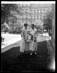 Women with anti-war poster, Washington, D.C. LCCN2016824256