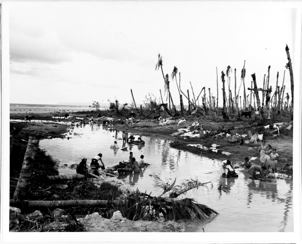Women washing clothes in a river near Hagåtña on 12 August 1944