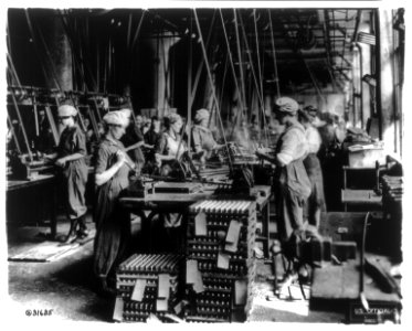 Women working in ordnance plants in World War I- spanner slotting fuse on head end of fuse bodies at Gray & Davis Co., Cambridge, Mass. LCCN2004673216
