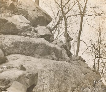 Women's Reserve Camouflage Corps hiding in rocks
