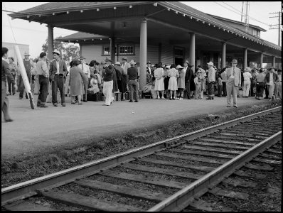 Woodland, California. Families of Japanese ancestry have come in from the ranches this morning and . . . - NARA - 537898 photo