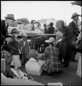 Woodland, California. Families of Japanese ancestry with their baggage at railroad station awaiting . . . - NARA - 537806