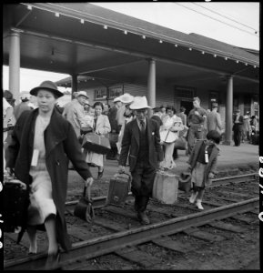 Woodland, California. Families of Japanese ancestry leave the station platform to board the train f . . . - NARA - 537810