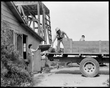 Woodland, California. Preparations are being made to evacuate this farm on the following day. A ne . . . - NARA - 537764 photo