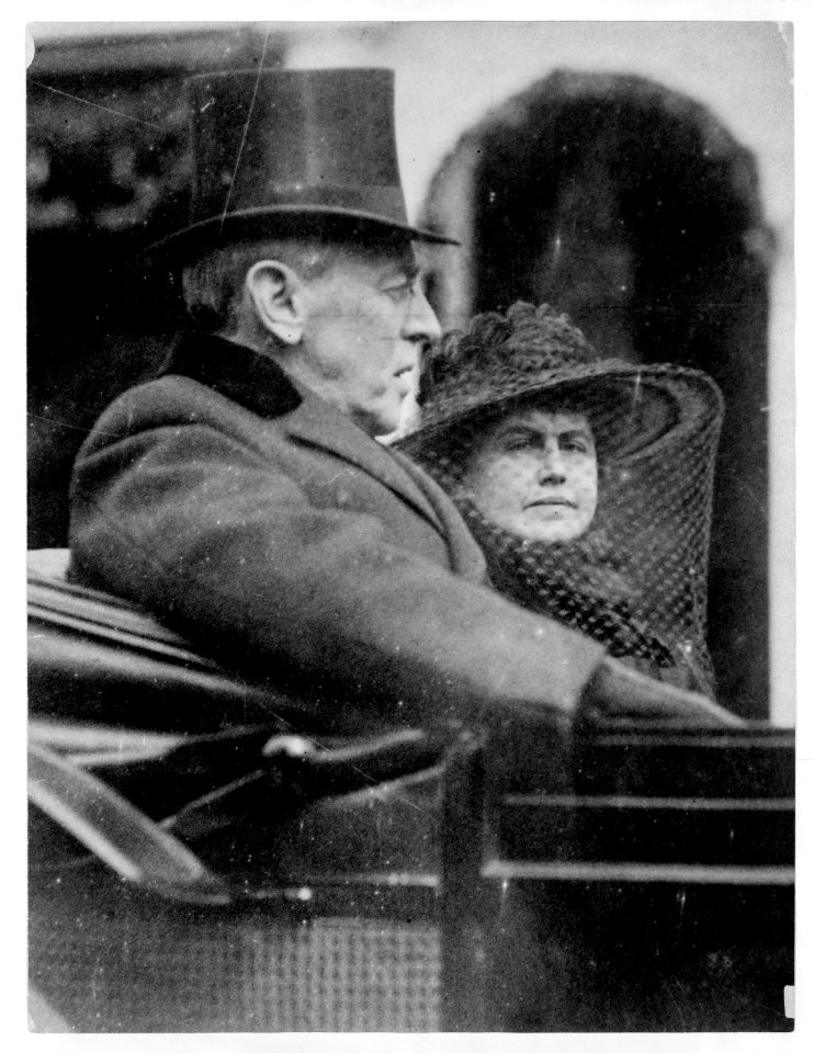 Woodrow Wilson and wife riding in backseat of a carriage to second inauguration, March 5th, 1917 LCCN96522409