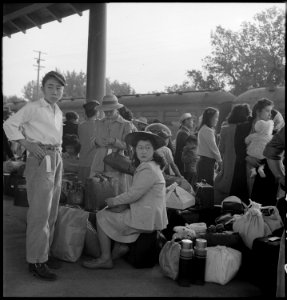 Woodland, California. Families of Japanese ancestry with their baggage at railroad station awaiting . . . - NARA - 537804