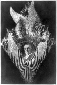 Woodrow Wilson; bust, framed by U.S. eagle and flags LCCN2007683073