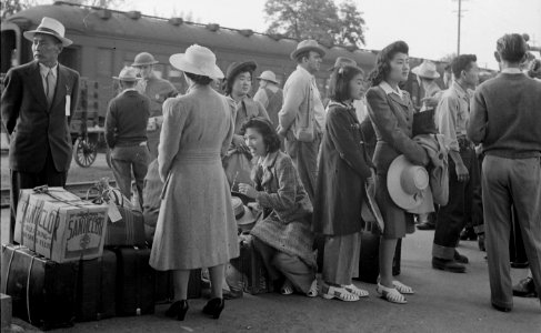 Woodland, California. Families of Japanese ancestry with their baggage at the railroad station wait . . . - NARA - 537805 (cropped)