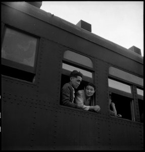 Woodland, California. Ten cars of evacuees of Japanese ancestry are now aboard and the doors are cl . . . - NARA - 537821 photo