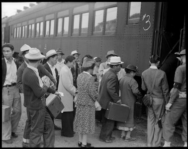 Woodland, California. Evacuees of Japanese ancestry are boarding a special train for Merced Assembl . . . - NARA - 537818 photo