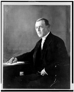 Woodrow Wilson, three-quarters length portrait, seated, facing slightly left LCCN93503450 photo