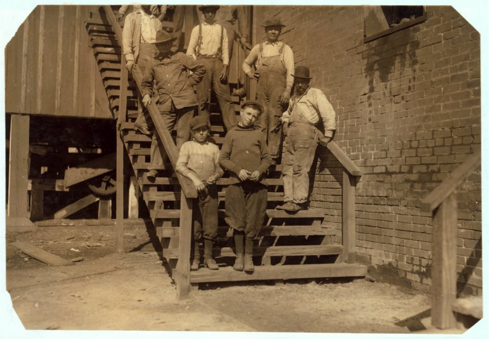 Workers in Miller & Vidor Lumber Co. Dangerous work. Charlie McBride said twelve years old. This twelve year old boy has a steady job. He takes the slabs out of the chute which has a moving LOC nclc.04911