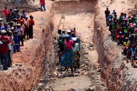 Workers build dam in Binga, Zimbabwe (36938575862)
