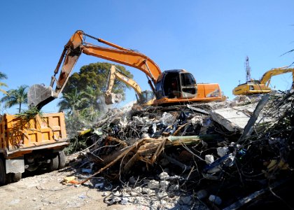 Workers remove debris from the Hotel Montana in Port-au-Prince, Haiti, 2010