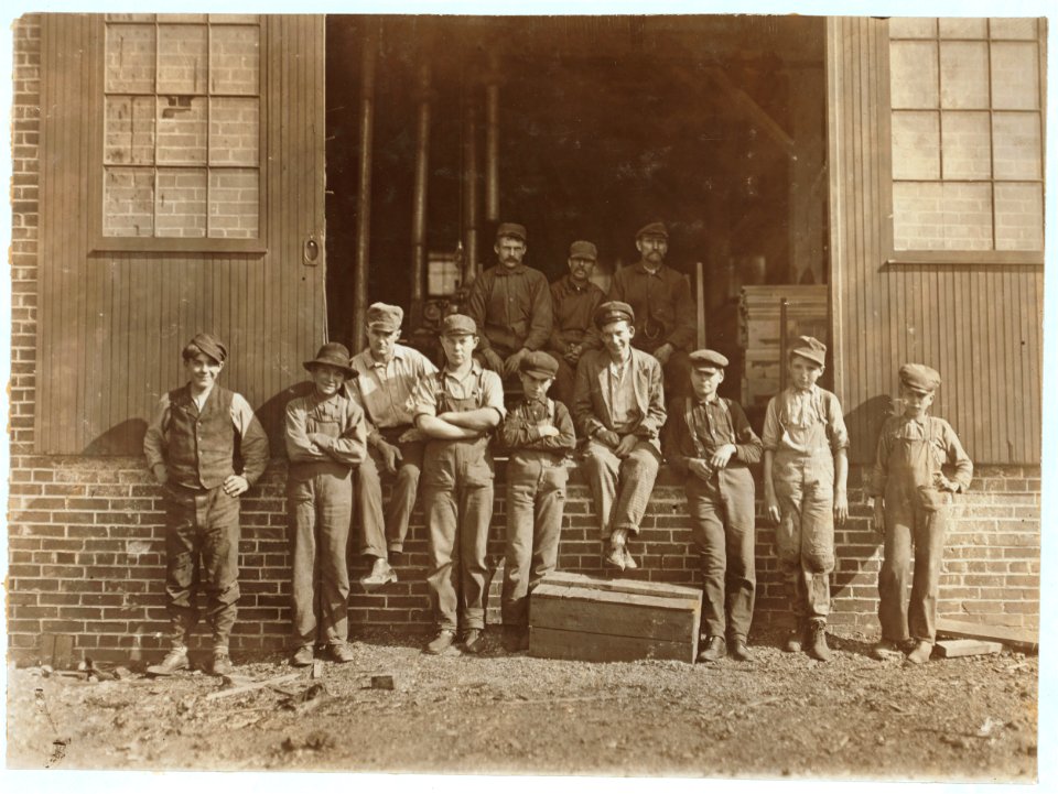 World Furniture Company noon hour, Evansville, Ind. Boy at left hand end was running Machine Composed of two Unguarded Circular Saws. The board he was pushing stuck and he gave it an LOC nclc.04479