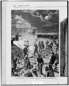 Workmen laying the new railroad track on the night of September 5th - from sketches by a staff artist. LCCN95509679