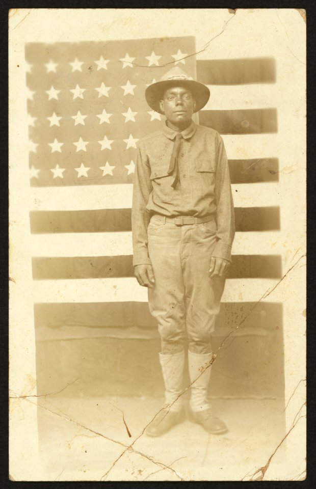World War I soldier with American flag in background LCCN2010651602
